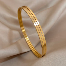 Carregar imagem no visualizador da galeria, Braceletes (03 peças) - Aço Inoxidável e Banho em Ouro 18k
